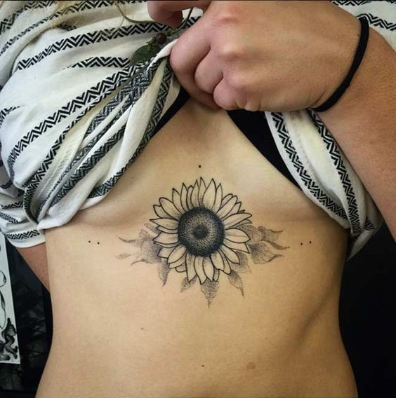 Sunflower Sternum Tattoo. 